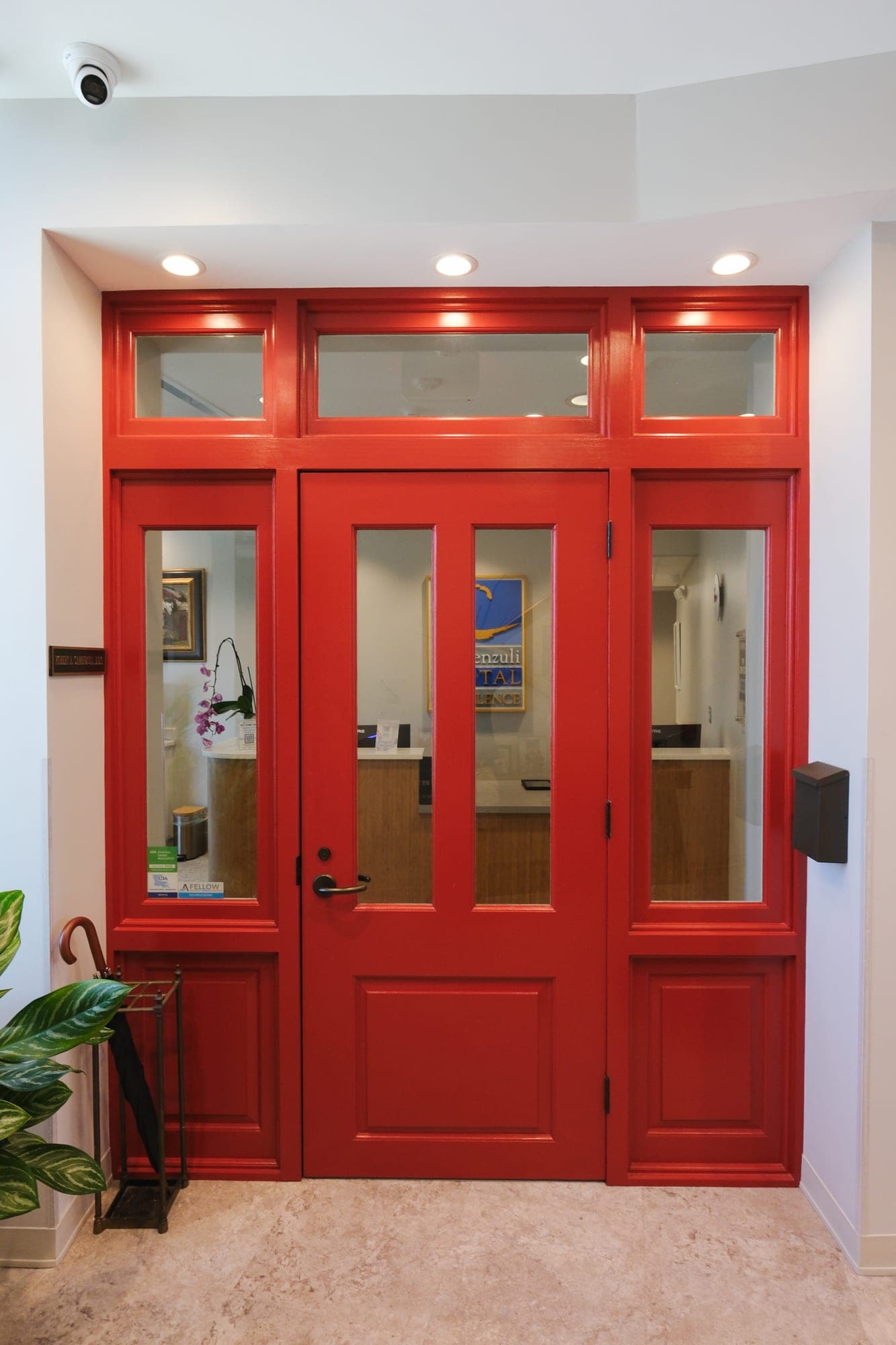 The signature red door at the entrance to Camenzuli Dental Excellence