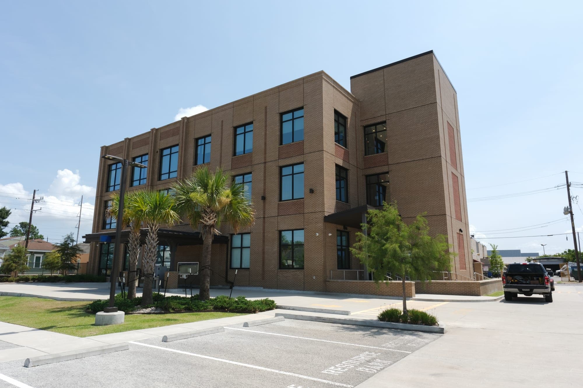 The exterior of the Camenzuli Dental Excellence building under a clear sky