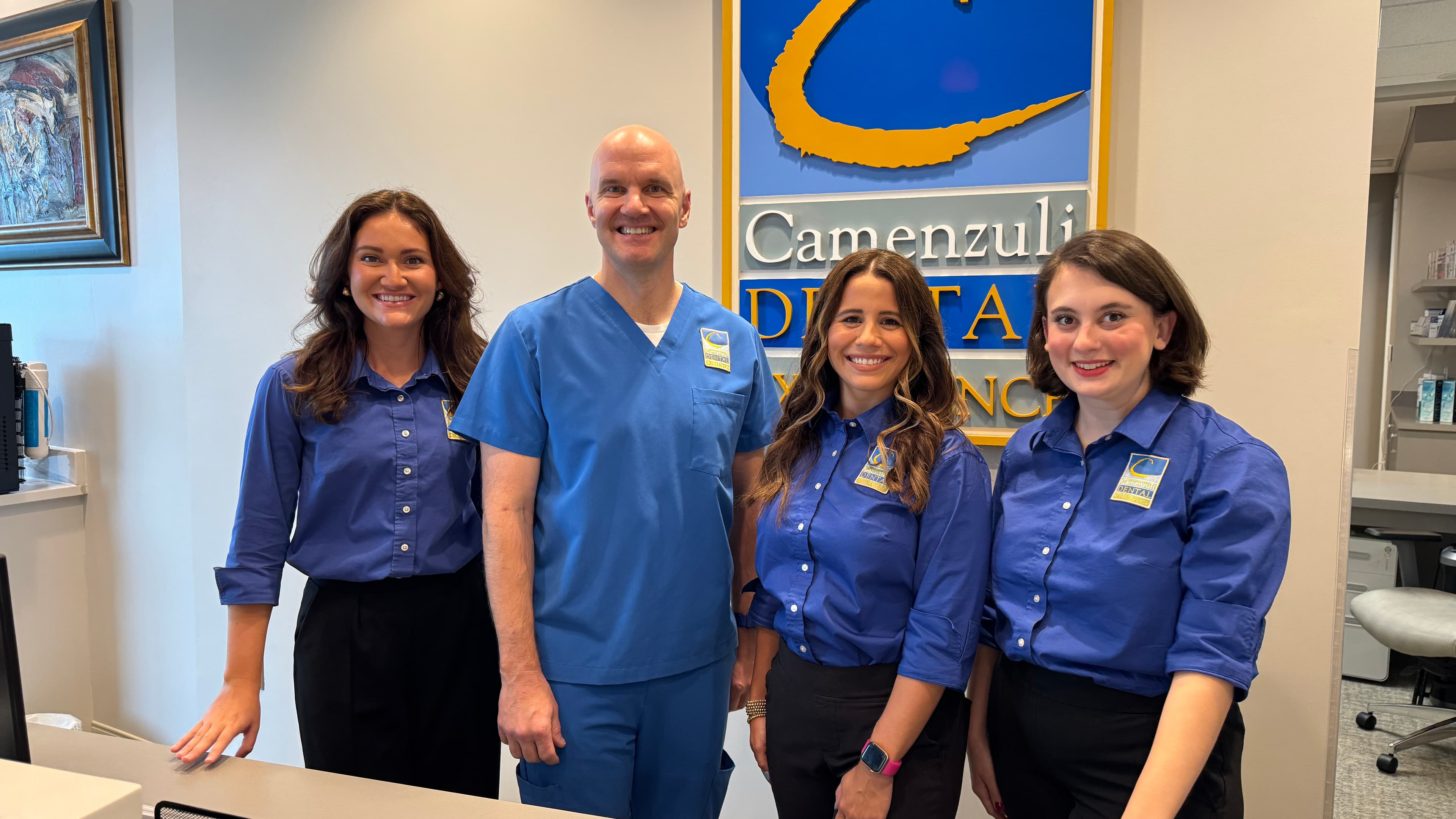 Dr. Camenzuli and the front desk team at Camenzuli Dental Excellence