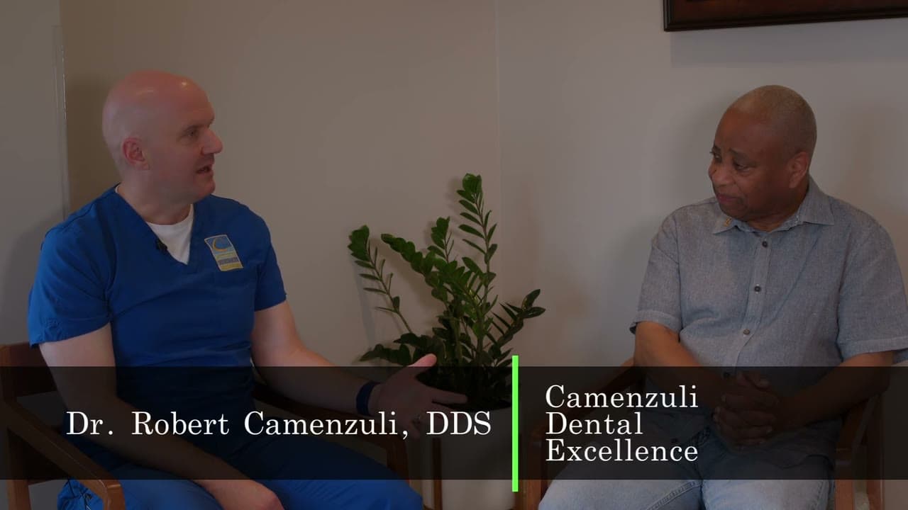 Dr. Robert Camenzuli in conversation with a patient at Camenzuli Dental Excellence