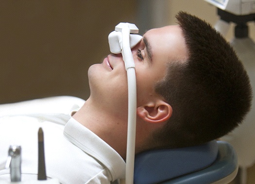 Man smiles with nitrous oxide sedation in Uptown New Orleans