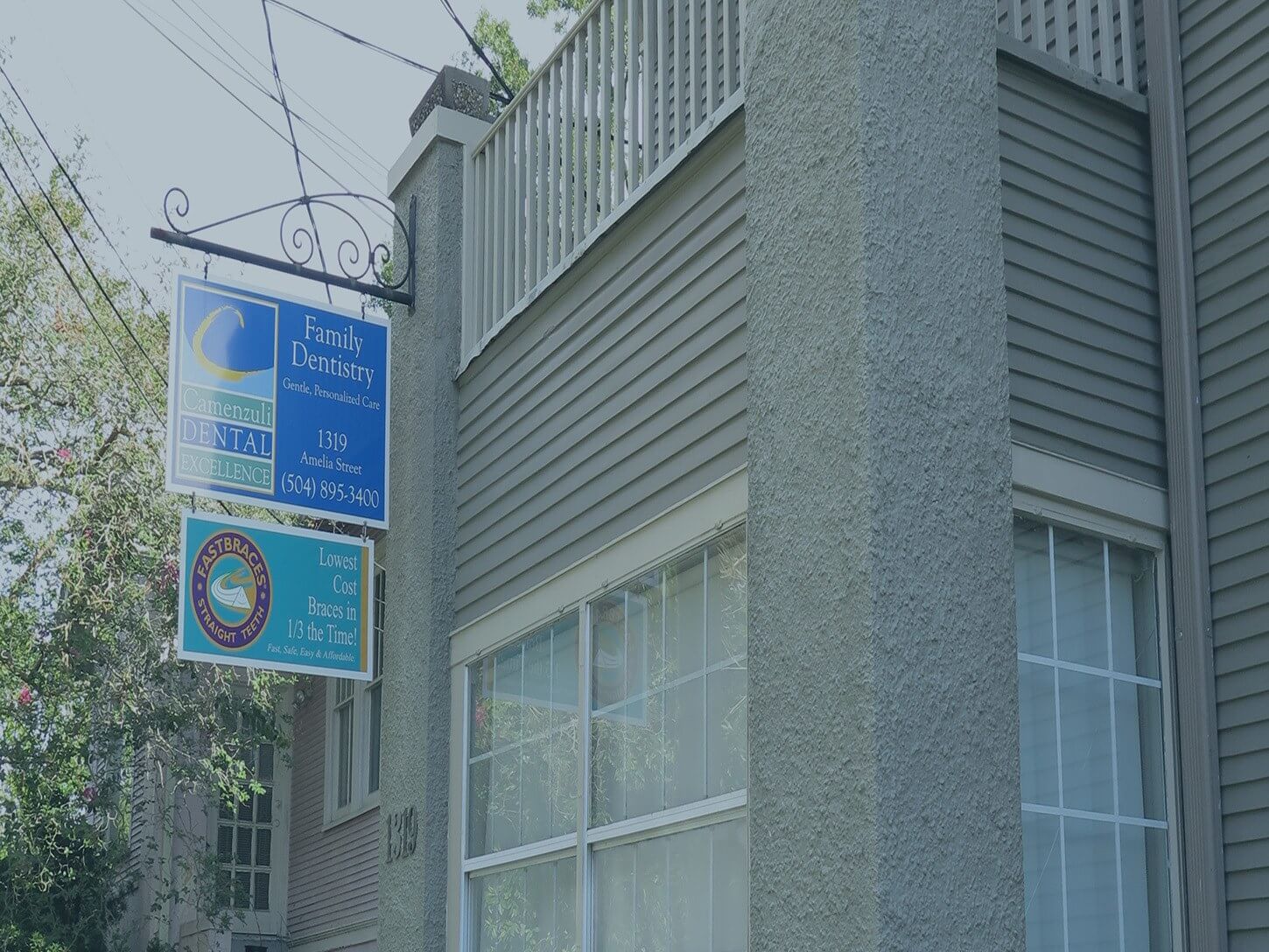 The Camenzuli Dental Excellence sign on Uptown New Orleans building