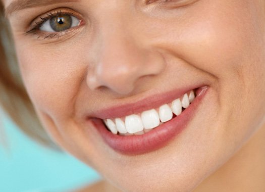Closeup of someone with a perfectly white smile 
