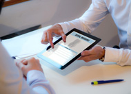 Patient reviewing dental insurance form on tablet