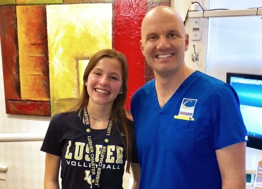 Dr. Camenzulie and young dental patient