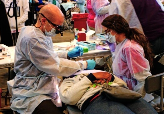 Dr. Camenzuli and team member treating dental patient