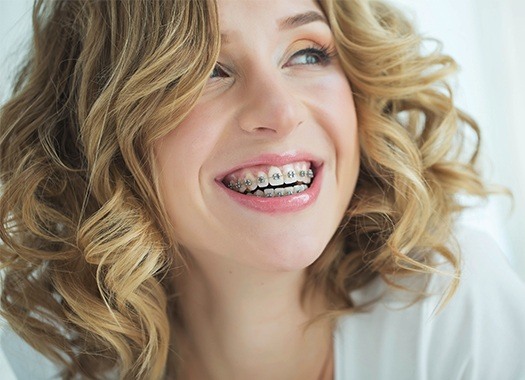Woman with braces sharing beautiful smile