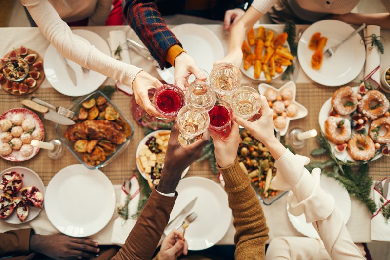 A group people celebrating a holiday dinner.