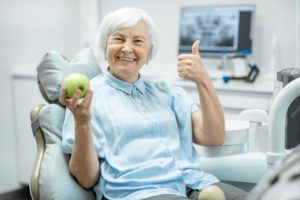 woman smiling about dental implant technology in uptown new orleans