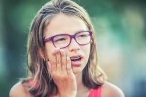 girl with ulcer caused by braces