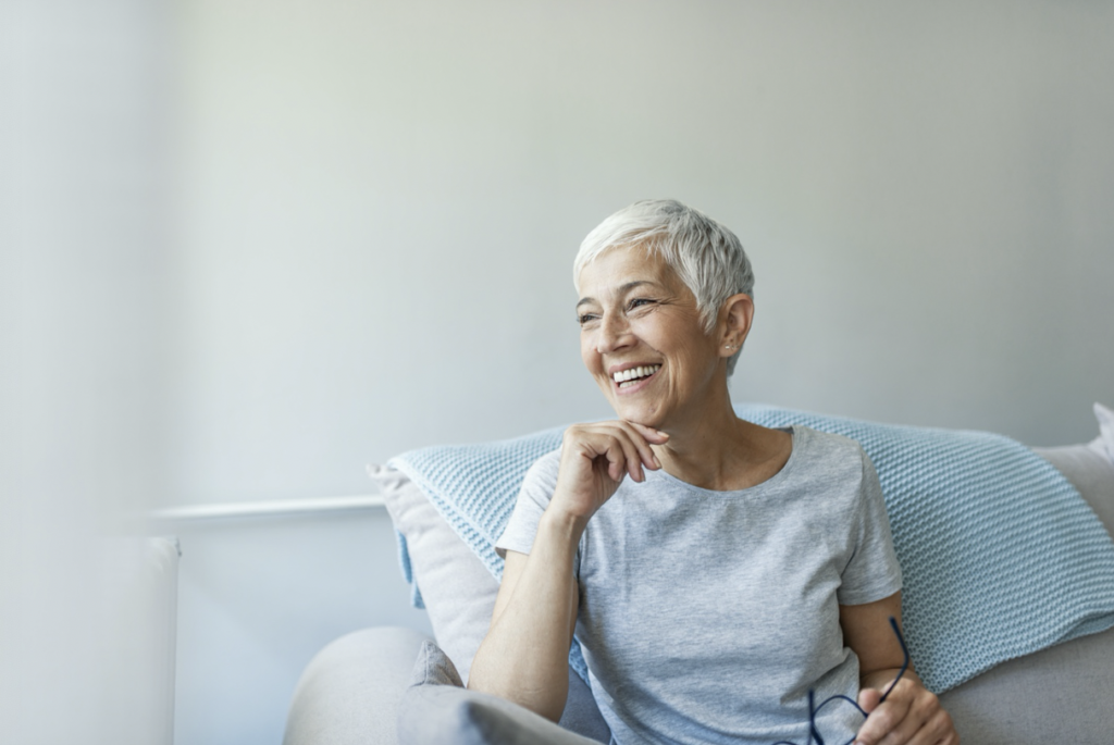 elderly woman smiling with dental implants in New Orleans