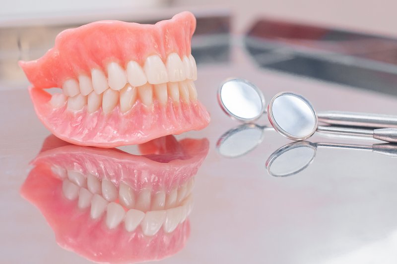 Two dentures on glass countertop