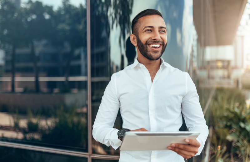 Smiling young professional in an office