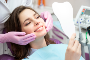 a patient smiling after receiving cosmetic dental treatment